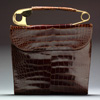 Koret Luggage colored alliagtor purse with safety pin handle